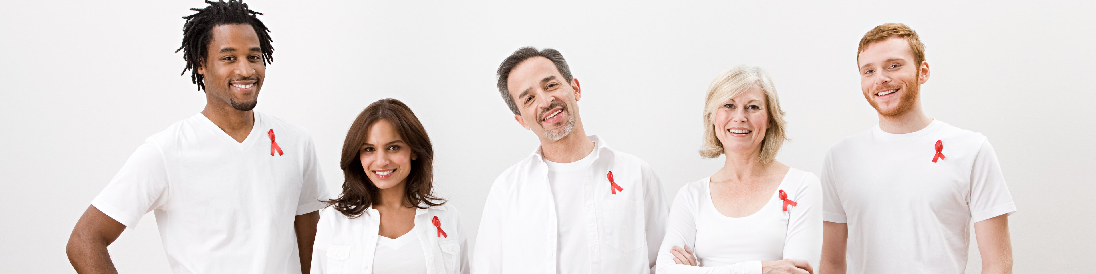 Ein Team trägt die Aids-Schleife | © Image Source - Getty Images